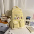 Yellow canvas school backpack with clear front pocket, cute badges and plush pendant, ins style. - With Charm / Yellow