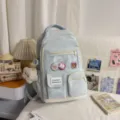 Light blue aesthetic school backpack with multi pockets, cute badges and plush pendant accessory. - With Charm / Blue