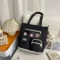 Korean style canvas tote bag for students, multi-pocket casual shoulder handbag in black. - Cram School Bag with Pendant / Black