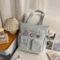 Korean style casual canvas tote bag with multiple pockets and cute bear pendant for students. - Cram School Bag with Pendant / Blue