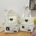 Set di zaino e borsa a tracolla a pois bianchi con simpatico gatto per studenti. - Set di Due Pezzi Con Ciondolo / Bianco