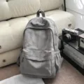 Zaino minimalista grigio in camoscio da donna, grande borsa scolastica capiente. - senza ciondolo / Grigio