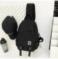 Black unisex casual nylon crossbody chest bag with N patch and cute plush charm pendant. - With Pendant / Black