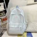 Light blue polka dot backpack with front pocket and side drawstring for daily school use. - No Pendant / L / Blue