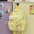 Cute Japanese style school backpack with star pattern and plush doll charm for girls daily use. - Small (With Pendant) / Yellow