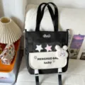 Casual black and white canvas backpack with multi-compartments and cute plush pendant. - Shoulder Bag / With Pendant / Black