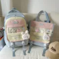 Color-block school backpack set with cute plush rabbit pendant and clear front pocket for students. - Two-Piece Set / With Pendant / Blue