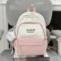 Mochila de lona linda con patrón de estrellas rosas, bolso informal para niñas y mujeres. - Con Colgante / Rosa