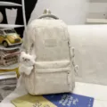 Campus style girl star studded large capacity backpack with cute bear pendant in beige. - Greedy Bear Pendant / White