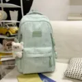 Mint green school backpack featuring star rhinestones and a cute bear pendant for students. - Greedy Bear Pendant / Blue