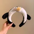 Cute plush penguin headband detail, soft fuzzy texture with adorable cartoon design for daily wear. - Black Penguin