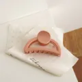 Matte pinkish half-moon hair claw clip for women, stylish geometric shark clip for daily use. - Orange