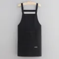 Professional black kitchen apron with zipper pocket adjustable straps for cooking and work use. - Black