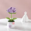 Detailed close-up of handmade crochet purple rose potted plant with green leaves in a cute pot. - Purple Single Head Rose Potted Plant