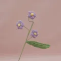 Handmade crochet puff flower branch detail shot, delicate knitting texture for home decor. - Light Purple