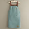 Tablier de cuisine imperméable avec imprimé arc-en-ciel, bretelles marron et poches avant. - Bleu cuir