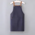 Dark blue canvas apron with brown straps and double pockets for kitchen cooking and work. - Regular Fit / Navy Blue