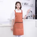 Stylish waterproof kitchen apron for women, durable cooking bib with large zip pocket. - Orange