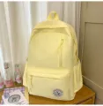 Light yellow casual backpack for students, stylish minimalist school bag with front pocket. - No Pendant / Yellow