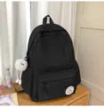 Casual black canvas school backpack for students, lightweight minimalist daypack with pockets. - Long Legged White Fur Ball / Black