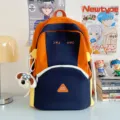 Cute color-block student backpack with cute puppy keychain, large capacity casual daypack. - Glasses Dog Pendant / L / Orange