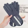 Detailed shot of dark grey touchscreen sun protection gloves with anti-slip design for outdoor use. - Dark Gray