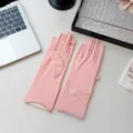 Detail view of ice silk sun protection gloves in pink, showing UPF50+ rating and fine fabric. - One Size / Pink