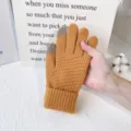 Detailed close-up view of yellow winter knitted touchscreen gloves with grey fingertips. - One Size / Yellow