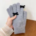 Grey knitted gloves detail, cozy winter handwear with elegant black velvet bows accent. - One Size / Gray