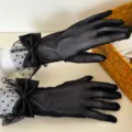Detailed shot of black sheer mesh gloves with elegant polka dots and cute satin bows for women. - One Size / Polka Dot Lace Bow / Black