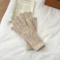 Detail shot of women winter oatmeal speckled knit touchscreen gloves on white bedsheet background. - One Size / Off White