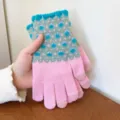 Detailed view of women's warm knit touchscreen winter gloves with pink and grey patterns. - One Size / Pink
