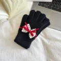 Black knitted touch screen gloves for women with elegant red ribbon and white lace bow. - One Size / Black