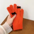 Orange knit winter gloves featuring cute black velvet bows. Soft wool material, warm five-finger. - One Size / Orange