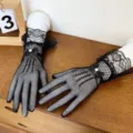 Detailed view of women black lace fishnet gloves with bow, elegant short mesh design for summer. - Small Bowknot / Black