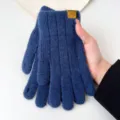 Close-up detail view of blue knitted thermal full finger winter gloves with coordinate label. - One Size / Navy Blue