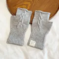 Grey cable knit fingerless gloves for women, warm winter hand warmer with cute label. - One Size / Gray