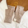 Detail shot of women's fingerless knit woolen gloves with cable texture for winter warm style. - One Size / Khaki
