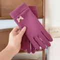 Detailed view of women's thermal fleece gloves featuring a cute bow accent for winter warmth. - One Size / Rose Red