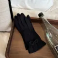 Detail view of women thermal velvet gloves with cute bow lace, black windproof winter wear. - One Size / Black