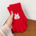 Red knitted winter gloves featuring a cute white bunny motif for warm and cozy daily wear details. - Red