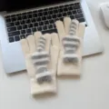 Knit warm winter gloves detail featuring fluffy striped cat design on cozy laptop background. - One Size / Cream