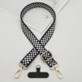 Black and white checkerboard phone strap with gold hardware and universal tether patch detail. - Black and White Plaid with T-Gasket