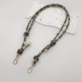 Detailed view of colorful beaded bag strap replacement, boho style lanyard with gold hardware. - Black Gray Gold Thread