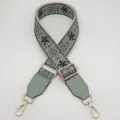 Detailed view of the retro ethnic embroidered wide adjustable bag strap replacement accessory. - Beige Base Mint Green With Mint Green Leather
