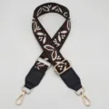 Tracolla di ricambio larga regolabile con motivo jacquard, ecopelle e minuteria metallica dorata. - Base Nera Marrone Scuro con Pelle Nera