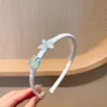 Serre-tête en tissu bleu clair pour enfants avec charm étoile de mer et dents. - Bandeau Étoile de Mer Bleue