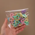 Set di piccoli elastici per capelli colorati, elastici senza cuciture per bambine. - Colore Chiaro 50 Pz Busta OPP