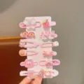 Vista dettagliata di un set di fermagli per capelli carini rosa con vari accessori. - Coniglio Farfalla Rosa