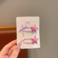 Vista dettagliata di graziose mollette per capelli per bambini con stelle marine e fiocchi. - Fermagli per Capelli Stella (Paio) / viola sfumato